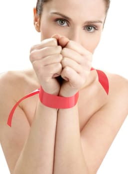 Beauty cosmetic portrait of funny tied hands woman with red tape