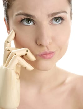 Funny woman cosmetic portrait, thinking with mannequin wooden hand