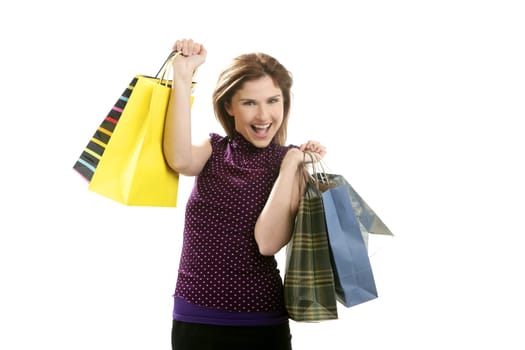 Shopaholic woman shopping with colorful bags isoalted on white