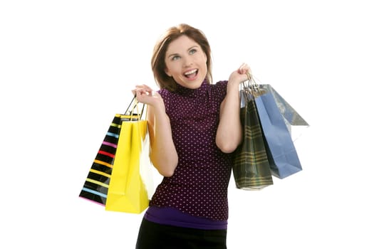 Shopaholic woman shopping with colorful bags isoalted on white