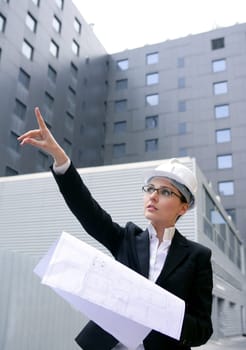 architect woman working outdoor with modern buildings