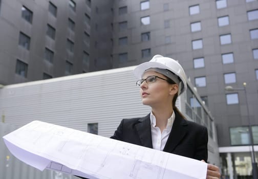 architect woman working outdoor with modern buildings