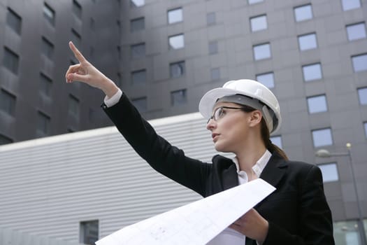 architect woman working outdoor with modern buildings