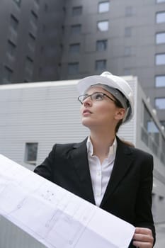 architect woman working outdoor with modern buildings
