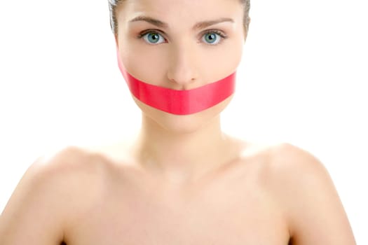 Beautiful woman with red tape on mouth portrait isolated on white