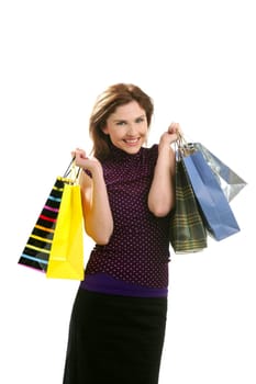 Shopaholic woman shopping with colorful bags isoalted on white