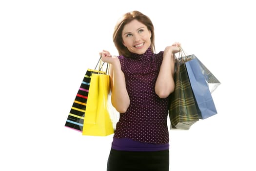 Shopaholic woman shopping with colorful bags isoalted on white