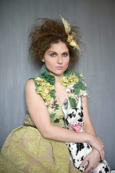 portrait of vanguard modern fashion woman with dalmatian dog