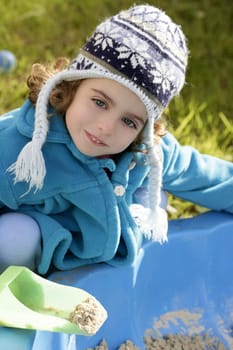 beautiful toddler girl winter wool hat portrait in outdoors