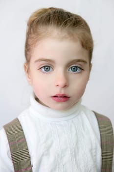 Beautiful preschooler blue eyes portrat with school dress