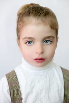 Beautiful preschooler blue eyes portrat with school dress