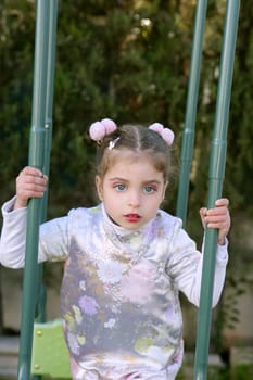 Beautiful little caucasian toddler girl with asian costume and makeup