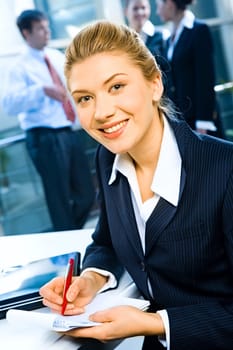 Portrait of young elegant business woman with charming smile