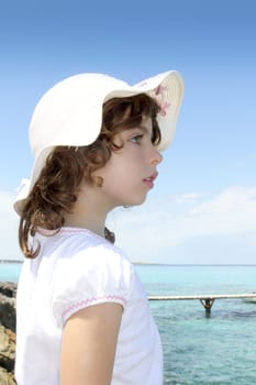 tourist little girl hat formentera turquoise sea Illetas Balearic Island