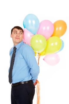 Image of successful businessman holding colorful balloons and looking at them