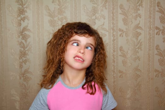 funny girl face ugly expression cross-eyed squinting on retro wallpaper