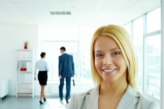 Portrait of a young beautiful businesswoman looking at camera in office