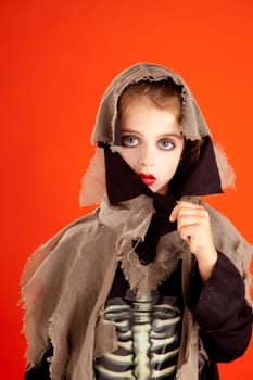 Halloween kid girl costume on orange background