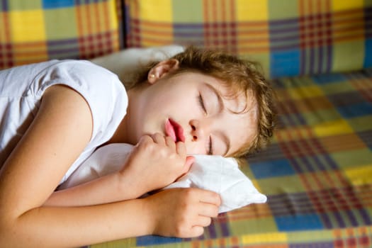 child girl sleeping bed in retro vintage quilt with pillow