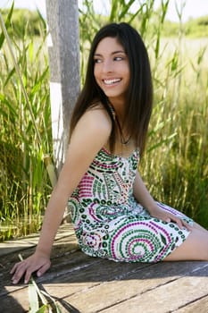Portrait of beautiful indian woman on nature, cane field