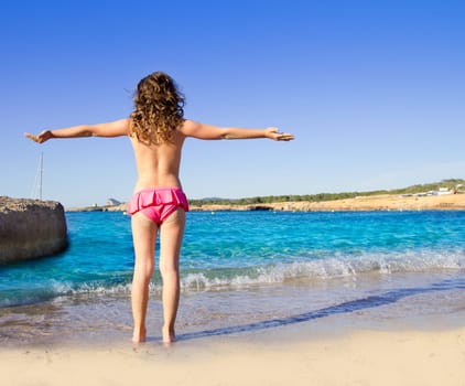 girl beach rear view in San Antonio of Ibiza Cala Conta