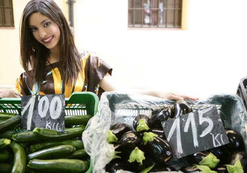 fashion beautiful indian woman in vegetables market outdoors