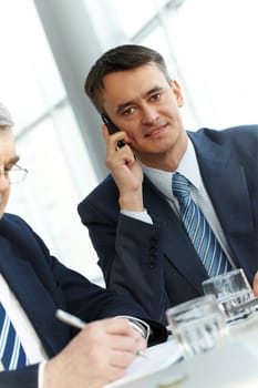 A young businessman talking on the phone