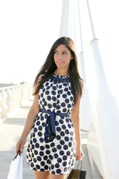 Beautiful brunette shopaholic outdoor modern city urban street