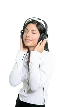 Beautiful brunette businesswoman hearing music on headphones