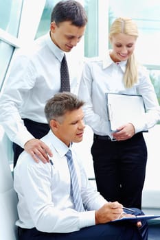Successful employees discussing business plan at meeting