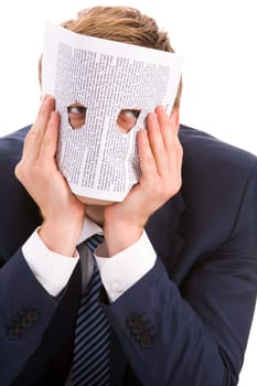 Portrait of businessman looking at camera through two holes in paper