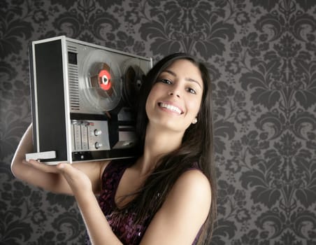 Retro open reel tape recorder beautiful brunette Dj hearing music gray walpaper