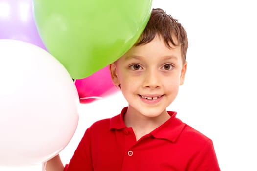 Portrait of happy boy with colorful balloons at birthday party