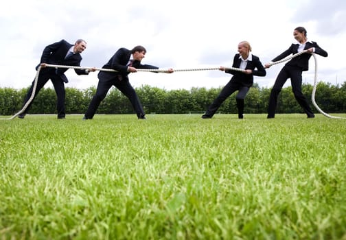 Image of business people standing in the stadium and playing