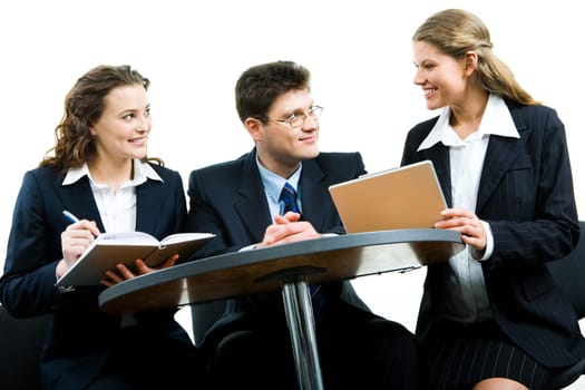 Image of two people looking at business woman at meeting