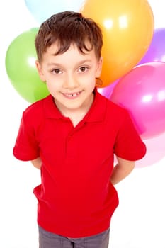 Portrait of happy boy with colorful balloons at birthday party