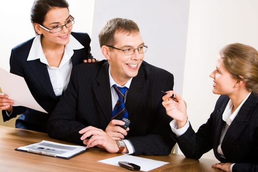 Image of business people looking at woman during discussion