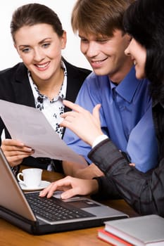 Two business demonstrating women a project to their boss
