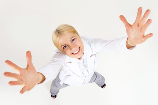 Above view of successful businesswoman stretching her arms at camera