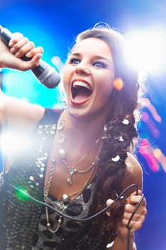 Portrait of a glamorous girl singing