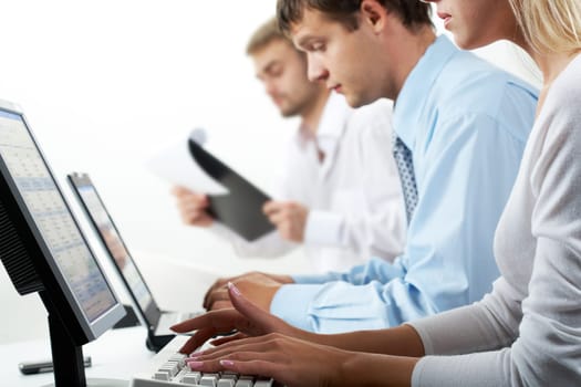 Image of female typing on keyboard in working environment