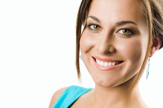 Face of pretty girl looking at camera with smile over white background