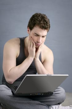 student gesture with laptop over gray background