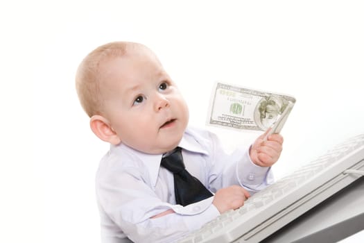 Portrait of serious baby boy giving hundred-dollar banknote to someone