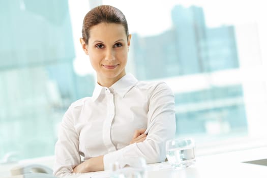 Photo of pretty businesswoman looking at camera