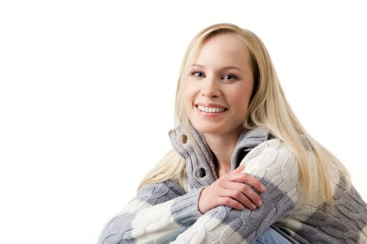 Portrait of blond female looking at camera and laughing