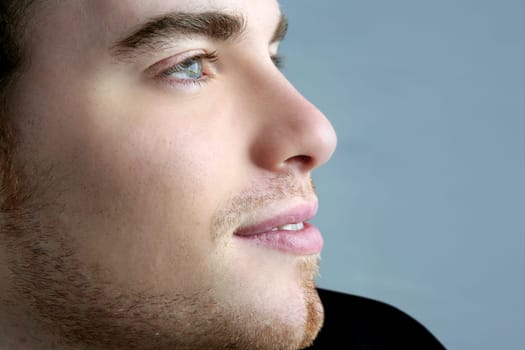 handsome profile smile portrait young man face detail closeup