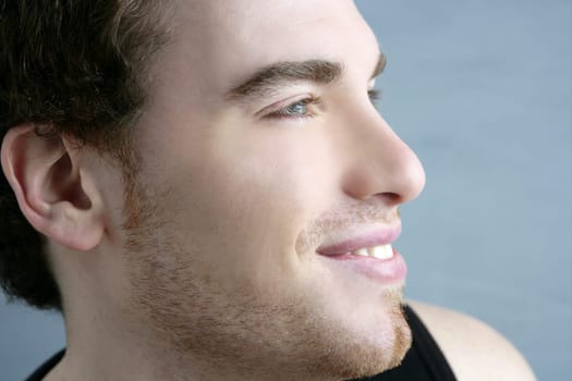 handsome profile smile portrait young man face detail closeup