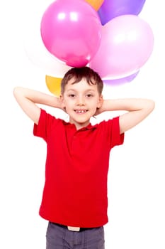 Happy boy with colorful balloons posing before camera