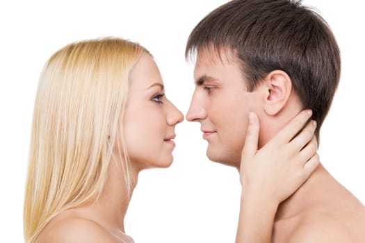 Profiles of two lovers before kissing each other isolated on white background